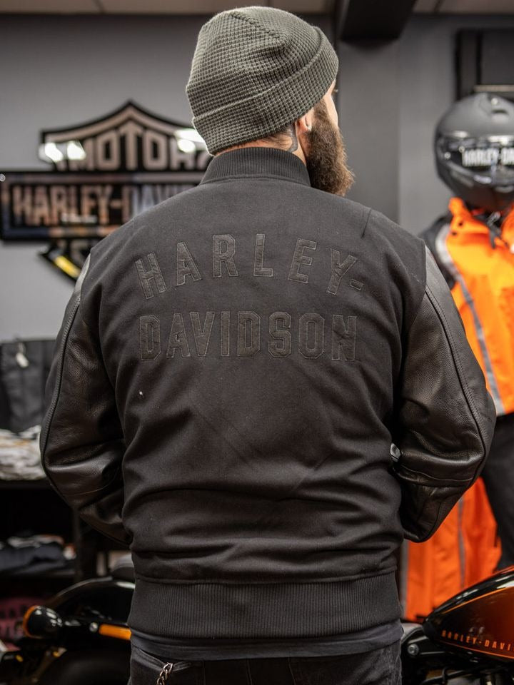 https://leatherjacketgear.com/cdn/shop/files/Harley-Davidson-Mens-Black-Varsity-Leather-Jacket-Model-Back.jpg?v=1696343316